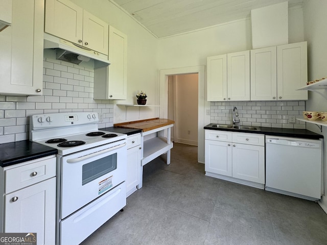 kitchen featuring white appliances, sink, decorative backsplash, and white cabinets