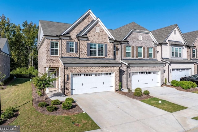 view of front of property featuring a garage and a front lawn