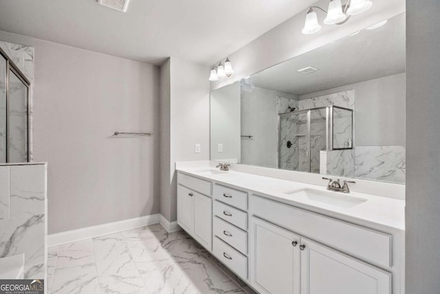 bathroom with vanity and a shower with shower door