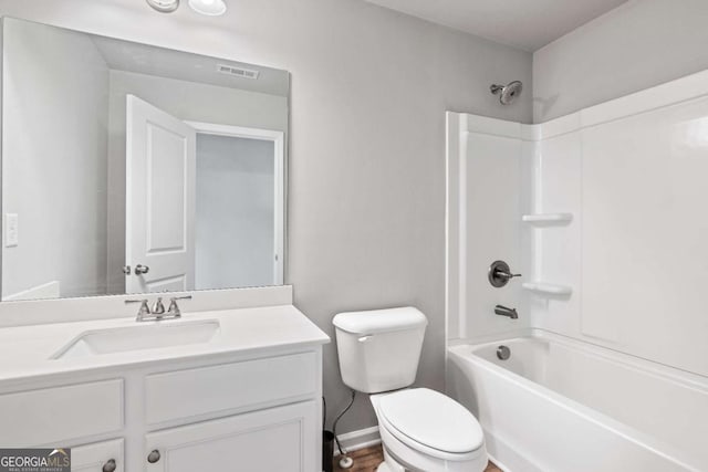 full bathroom featuring shower / washtub combination, toilet, and vanity