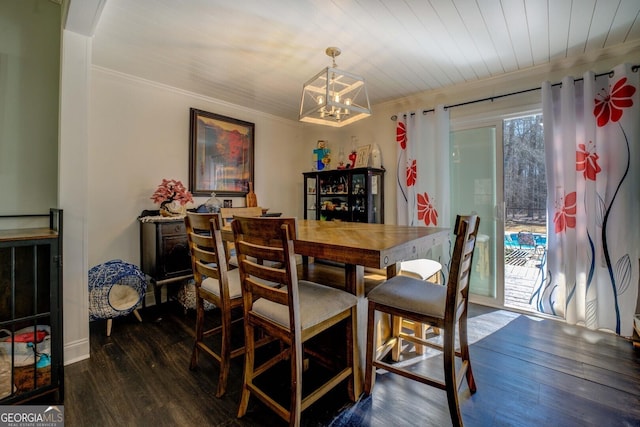 dining space with ornamental molding, dark hardwood / wood-style floors, and a chandelier