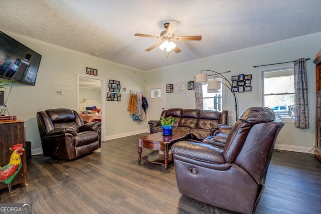 living room featuring crown molding, ceiling fan, dark hardwood / wood-style floors, and a textured ceiling