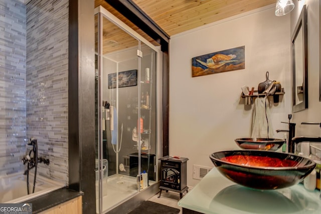 bathroom featuring vanity, a shower with shower door, and wooden ceiling