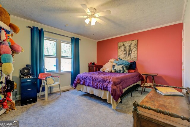 carpeted bedroom featuring a textured ceiling, ceiling fan, baseboards, and crown molding