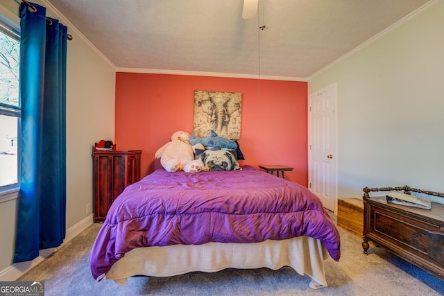 bedroom with crown molding, ceiling fan, carpet flooring, and a textured ceiling