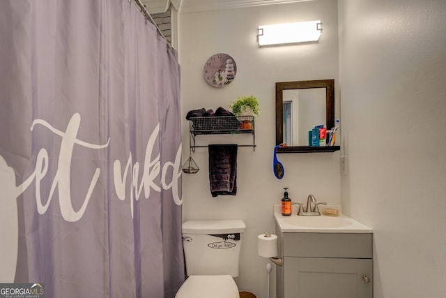 bathroom featuring vanity and toilet