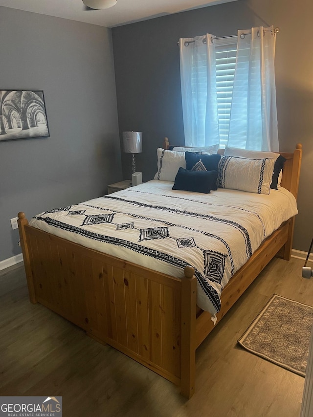 bedroom featuring hardwood / wood-style flooring