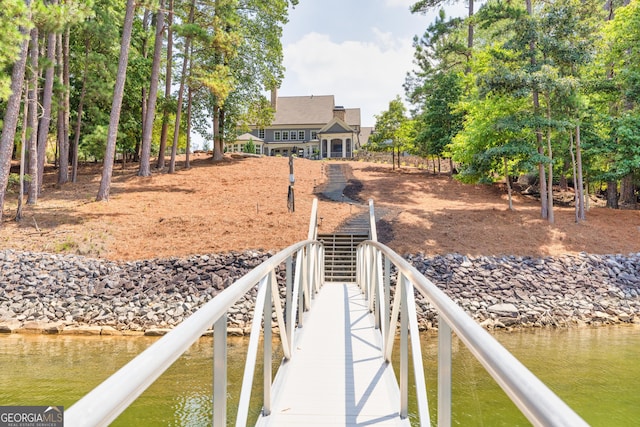 dock area with a water view