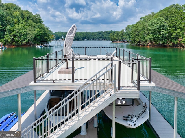 dock area with a water view and stairway