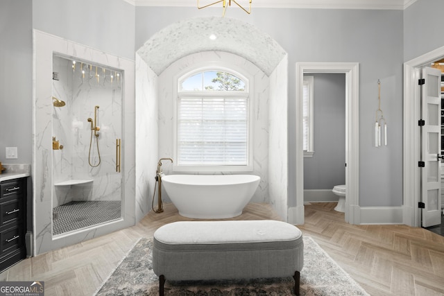 full bathroom with toilet, baseboards, a soaking tub, a marble finish shower, and crown molding