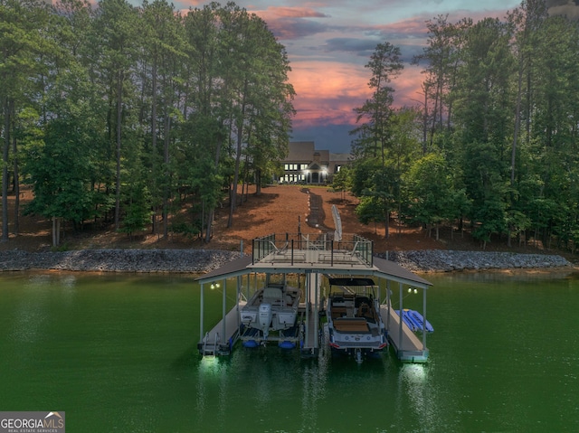 dock area with a water view and boat lift