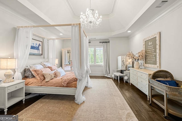 bedroom featuring a raised ceiling, ornamental molding, an inviting chandelier, and dark hardwood / wood-style flooring