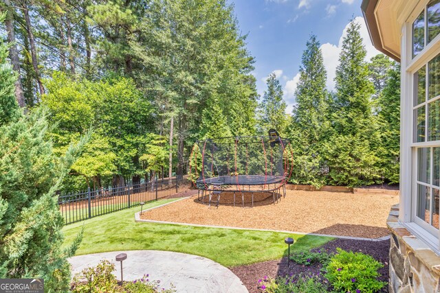 view of swimming pool with a sunroom, a patio, and an in ground hot tub