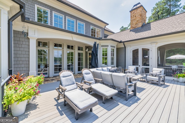 wooden deck featuring an outdoor hangout area and french doors