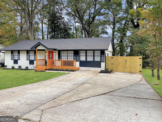 ranch-style home with a front yard