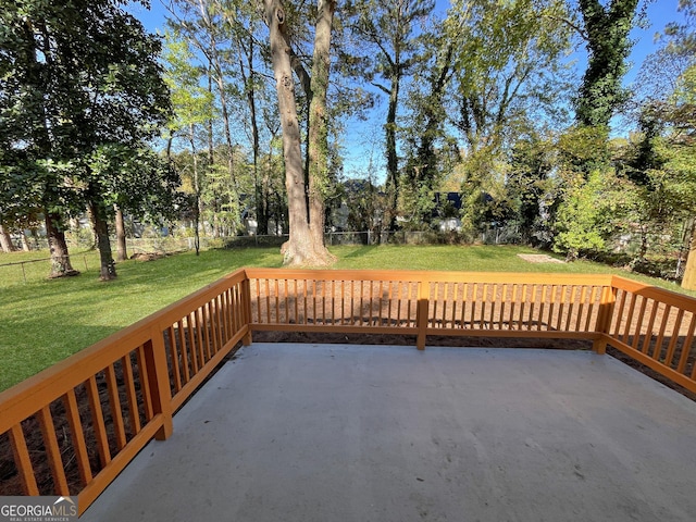 deck with a patio area and a lawn