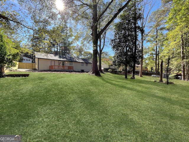 view of yard featuring a wooden deck