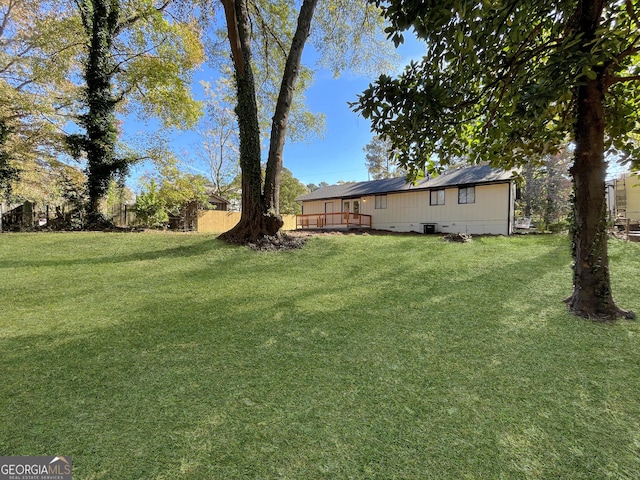 view of yard featuring a deck