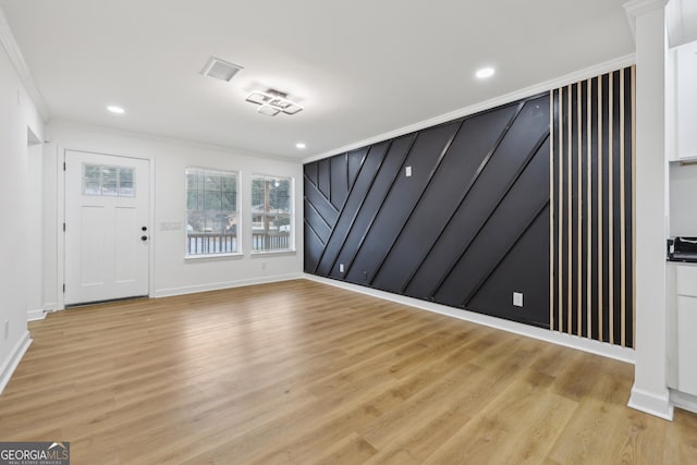 entryway with ornamental molding, recessed lighting, visible vents, and light wood-style flooring