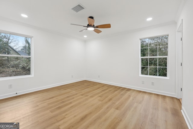 unfurnished bedroom featuring light wood finished floors, recessed lighting, visible vents, ornamental molding, and baseboards