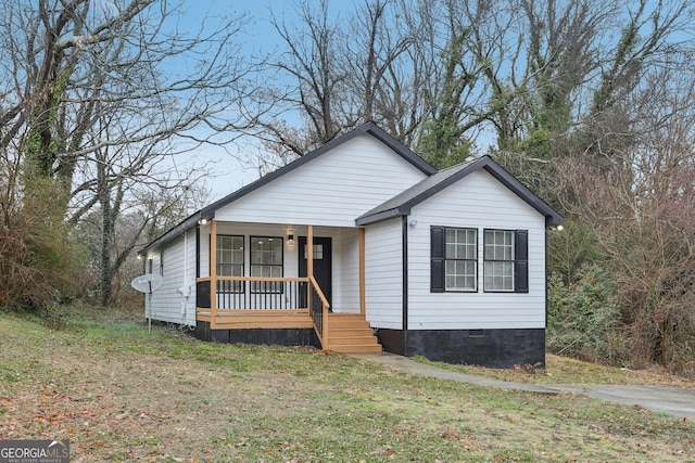 bungalow-style house with a porch and crawl space