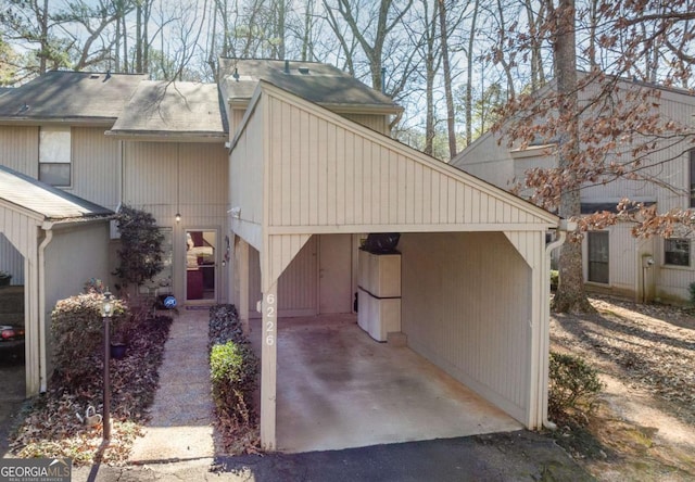 view of side of home featuring a carport