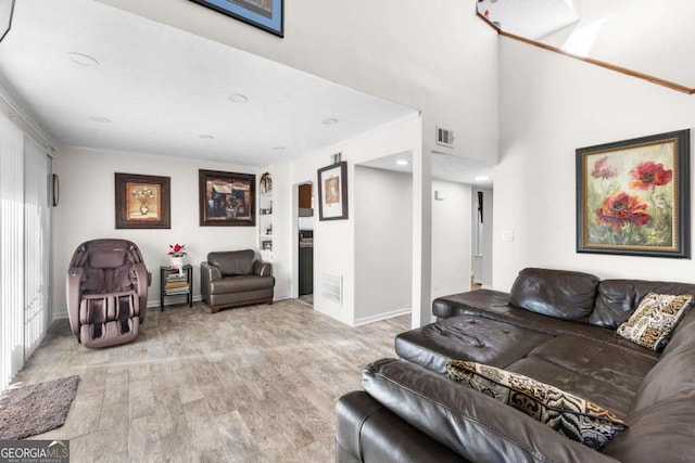 living room with light hardwood / wood-style floors