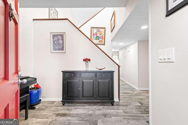 hallway with wood-type flooring