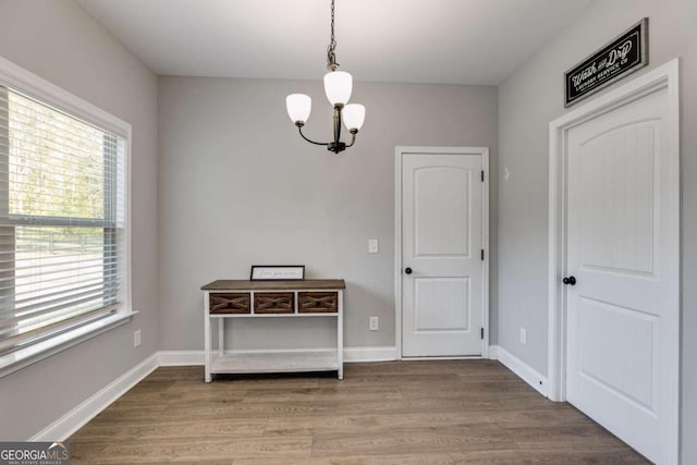 dining space featuring a chandelier and hardwood / wood-style floors