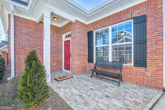 doorway to property with a patio area