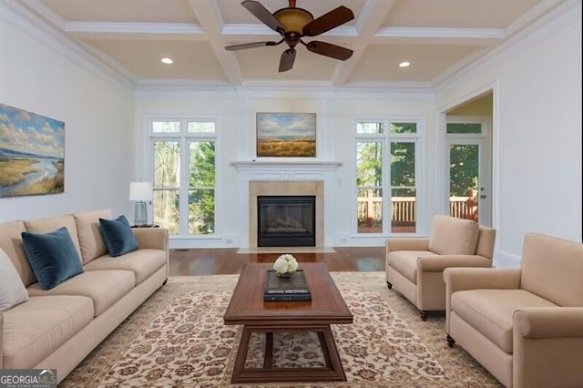 living room featuring coffered ceiling, hardwood / wood-style floors, and beam ceiling