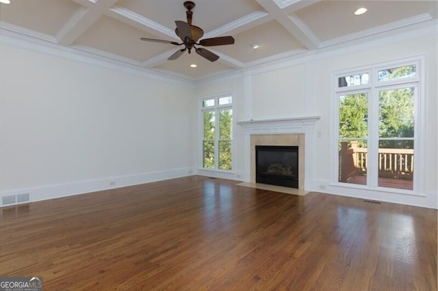 unfurnished living room featuring dark hardwood / wood-style floors, ceiling fan, ornamental molding, and coffered ceiling