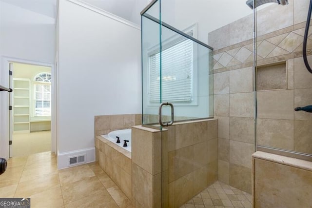 bathroom with tile patterned flooring and independent shower and bath