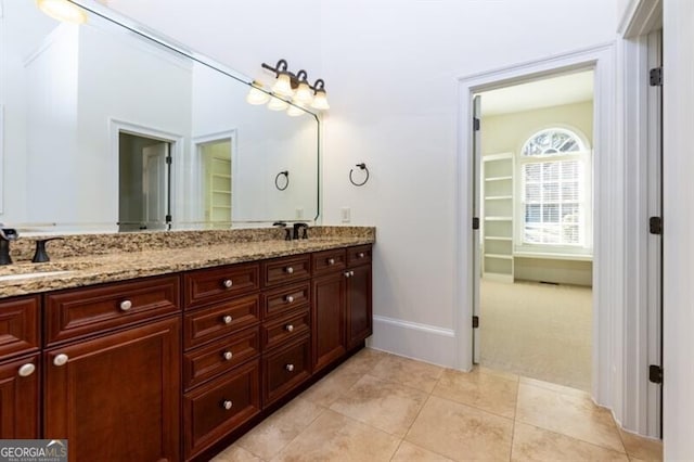 bathroom with vanity and tile patterned flooring