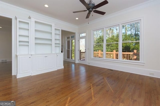 unfurnished living room with crown molding, ceiling fan, and dark hardwood / wood-style flooring