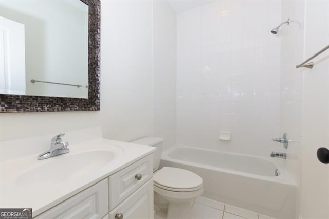 full bathroom with tiled shower / bath, vanity, toilet, and tile patterned flooring