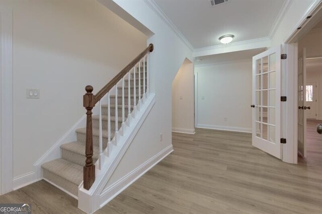 unfurnished room with hardwood / wood-style flooring, ceiling fan, and beam ceiling