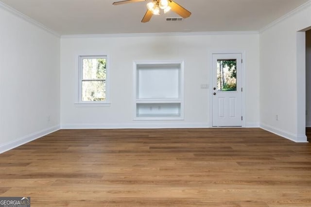 entrance foyer with crown molding, light hardwood / wood-style floors, and ceiling fan