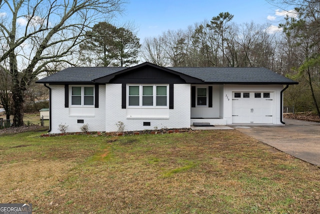 view of front of home featuring a garage and a front lawn