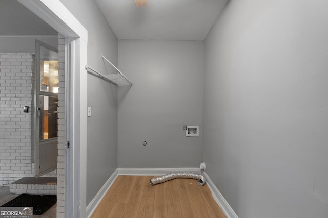 clothes washing area featuring wood-type flooring, hookup for a washing machine, and electric dryer hookup