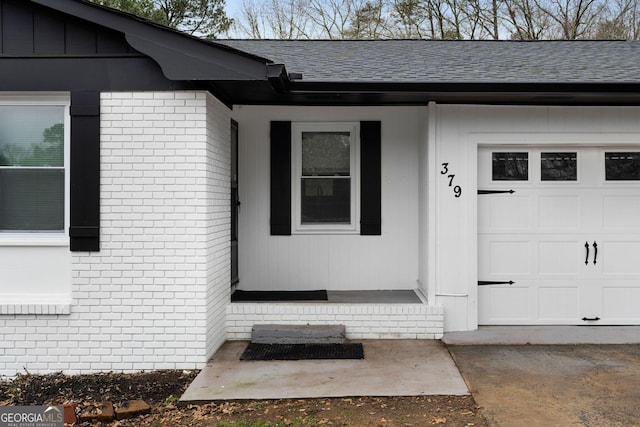 entrance to property featuring a garage