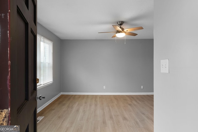 empty room featuring ceiling fan and light wood-type flooring