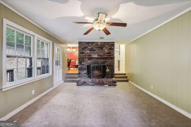 unfurnished living room featuring ornamental molding, carpet floors, and a textured ceiling