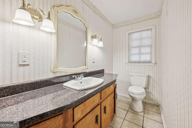 bathroom featuring tile patterned floors, toilet, and vanity