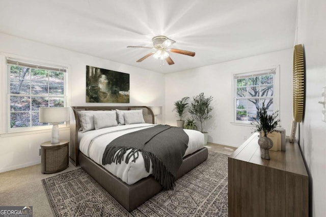 carpeted bedroom with ceiling fan