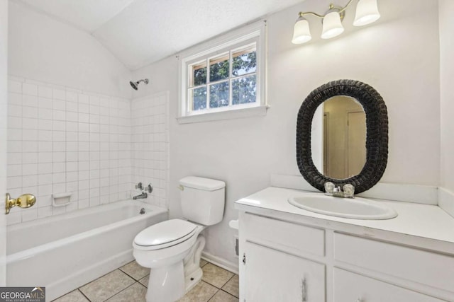 full bathroom with lofted ceiling, tile patterned flooring, tiled shower / bath combo, vanity, and toilet