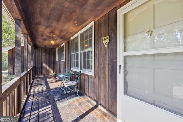 wooden deck featuring covered porch