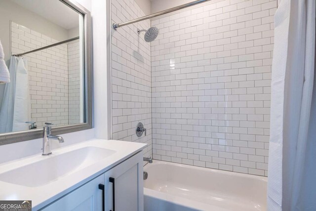 bathroom with vanity and shower / tub combo with curtain