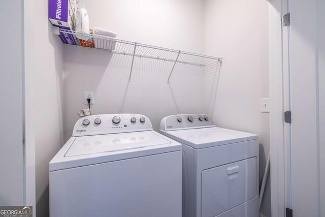 laundry room with washer and clothes dryer