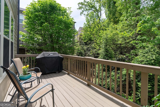 wooden terrace with area for grilling